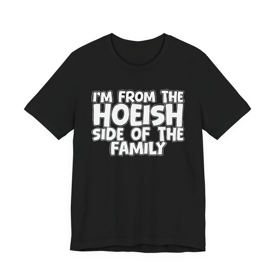 Black t-shirt with 'I'M FROM THE HOEISH SIDE OF THE FAMILY' in white hand-drawn bubble lettering on the chest, front flat-lay mockup view.