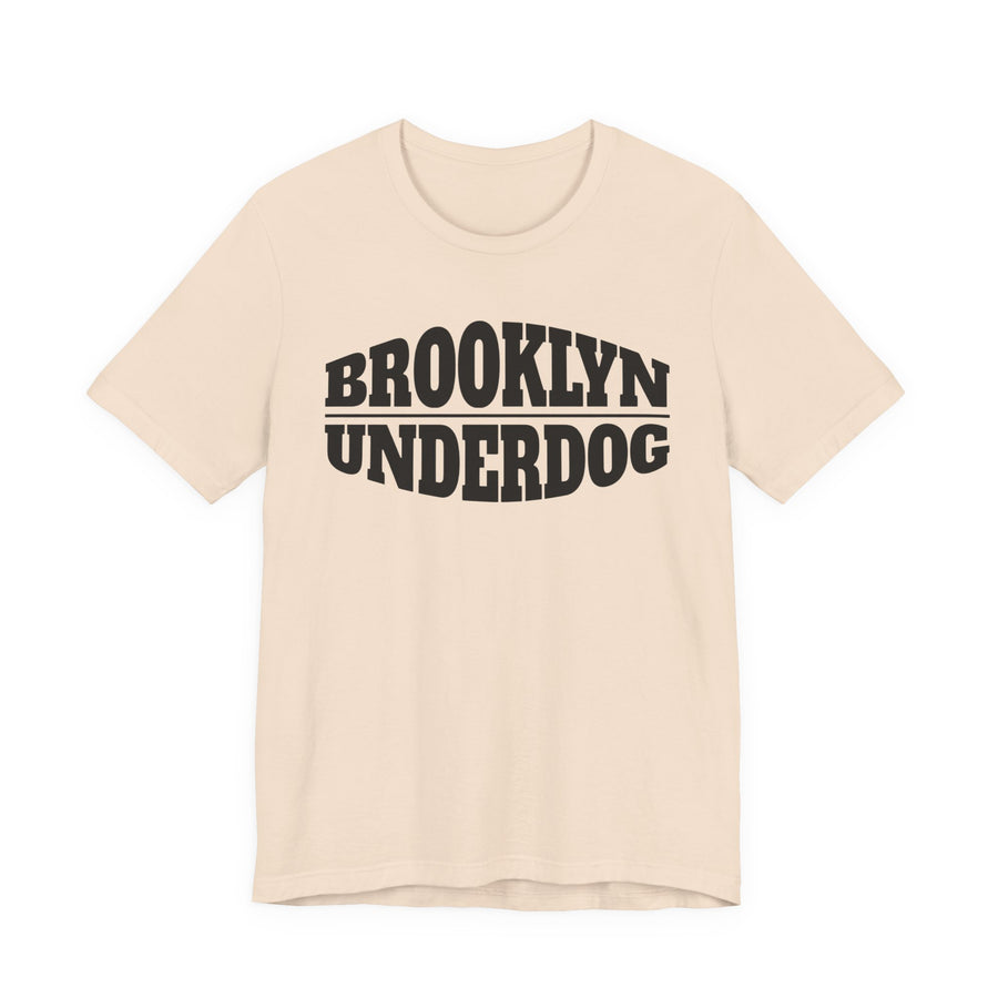 Natural T-shirt with black arched BROOKLYN and inverted-arch UNDERDOG collegiate print, front flat-lay view