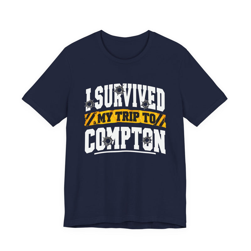 T-Shirt with collegiate lettering reading I SURVIVED MY TRIP TO COMPTON, front view.