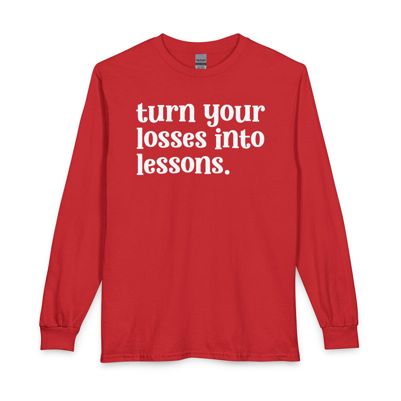 Red long sleeve t-shirt with white "turn your losses into lessons." lettering, front view.