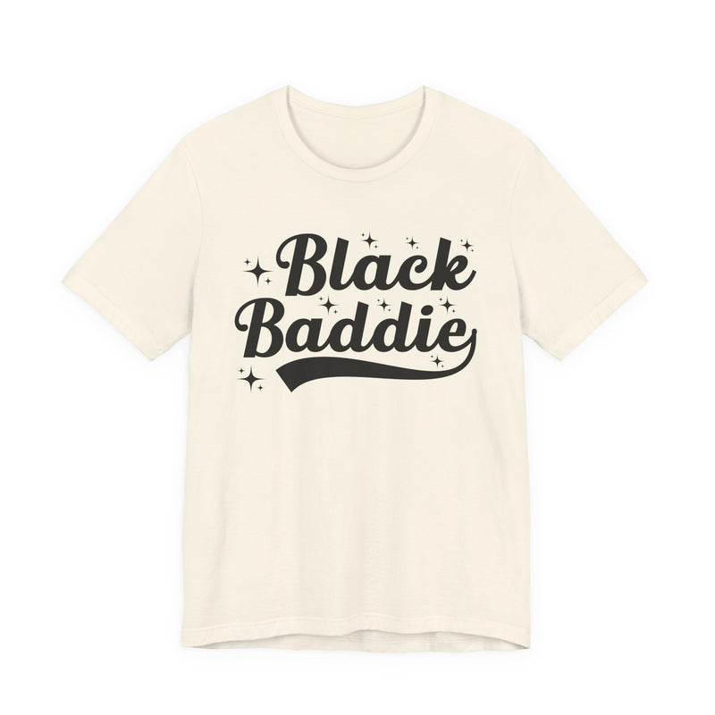 White t-shirt with dark bold statement lettering reading BLACK BADDIE, front flat-lay view.