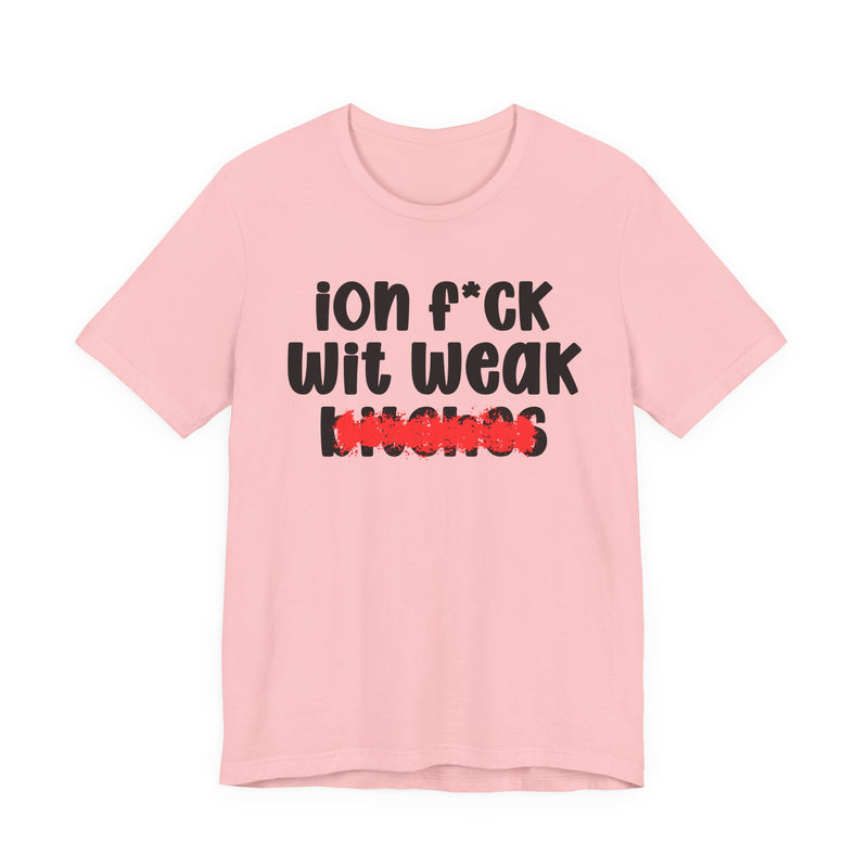 Pink t-shirt with black "ion f*CK Wit Weak bitches" statement graphic and red marker strike-through over the bottom word, front flat-lay on white background.