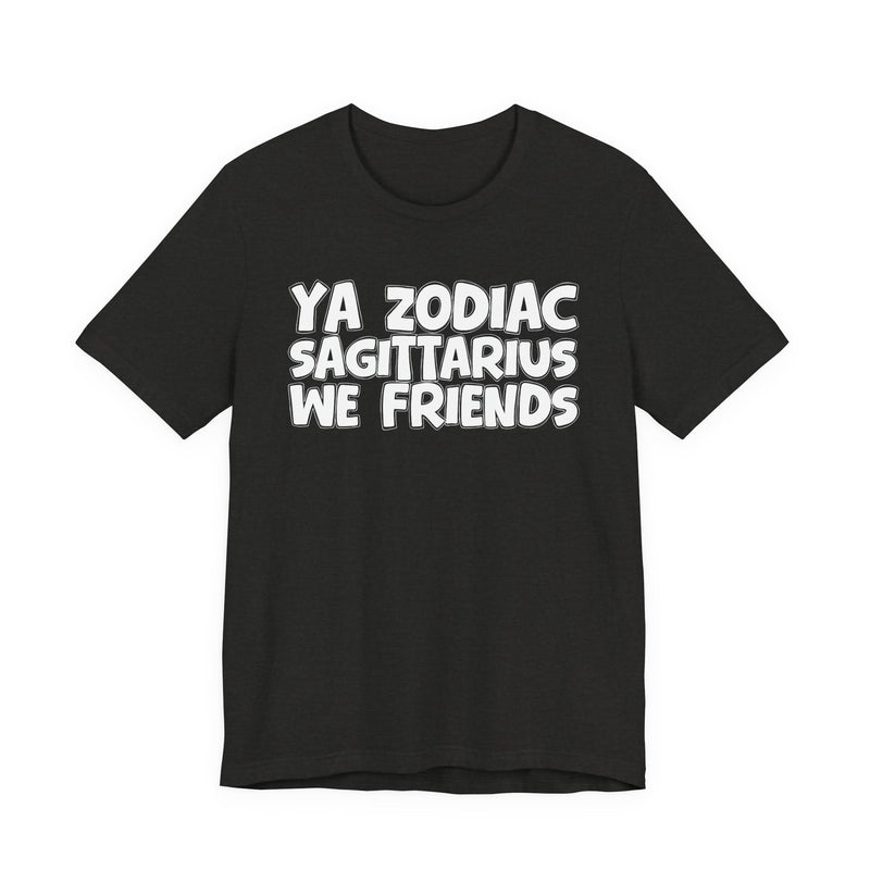 Black Heather t-shirt with white 'YA ZODIAC SAGITTARIUS WE FRIENDS' cartoon bubble lettering, front flat-lay view.
