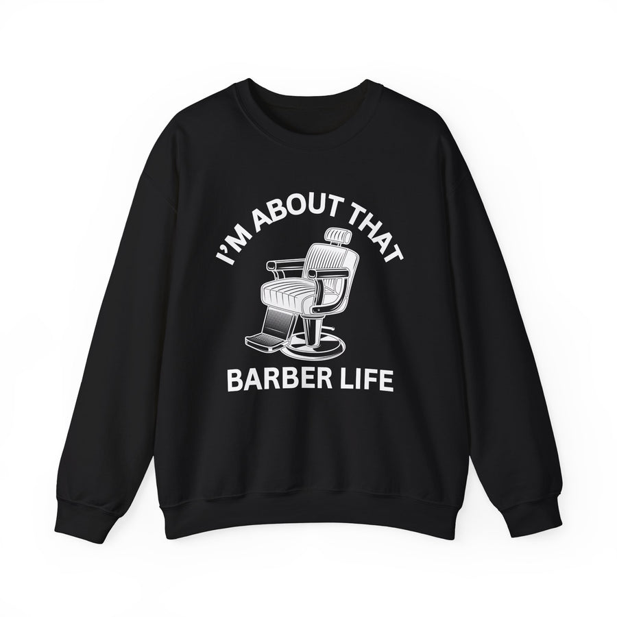I'm About That Barber Life — Sweatshirt front view: I'M ABOUT THAT arched over a barber chair graphic with BARBER LIFE below in white — white print on black. Street Talk Designs mood statement apparel.