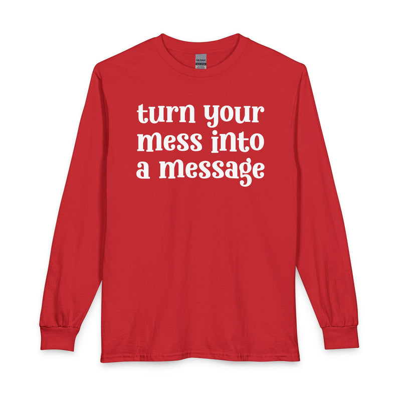 Red long sleeve t-shirt with white lettering reading "turn your mess into a message", front flat-lay view.