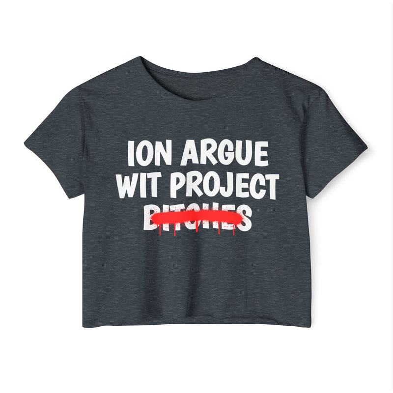 Antique Denim crop top with white stacked uppercase "ION ARGUE WIT PROJECT BITCHES" lettering, "BITCHES" crossed by a red spray-paint strike with drips, front flat-lay view.