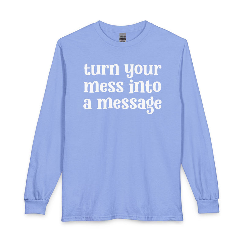 Sky blue long sleeve t-shirt with white lettering reading "turn your mess into a message", front flat-lay view.