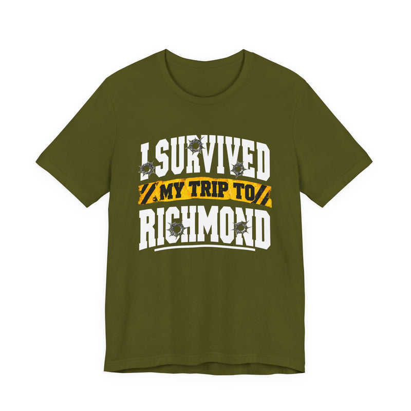 T-Shirt product photo with arched collegiate lettering reading "I SURVIVED" with bullet-hole decals, a caution-tape band reading "MY TRIP TO", and large block letters reading "RICHMOND", front view.