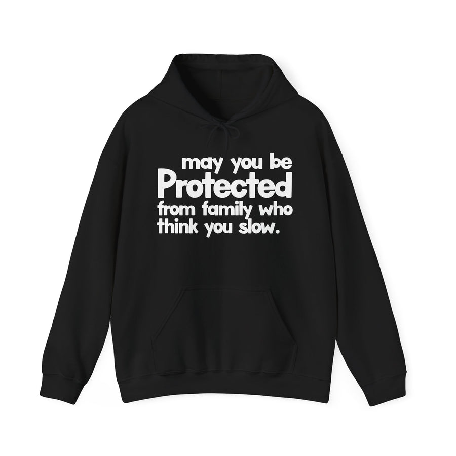 May You Be Protected From Family Who Think You Slow — Hoodie front view: MAY YOU BE PROTECTED FROM FAMILY WHO THINK YOU SLOW in bold statement lettering. Street Talk Designs protection statement apparel.