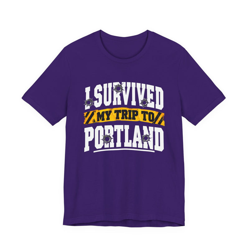 T-Shirt with collegiate lettering reading I SURVIVED MY TRIP TO PORTLAND, front view.