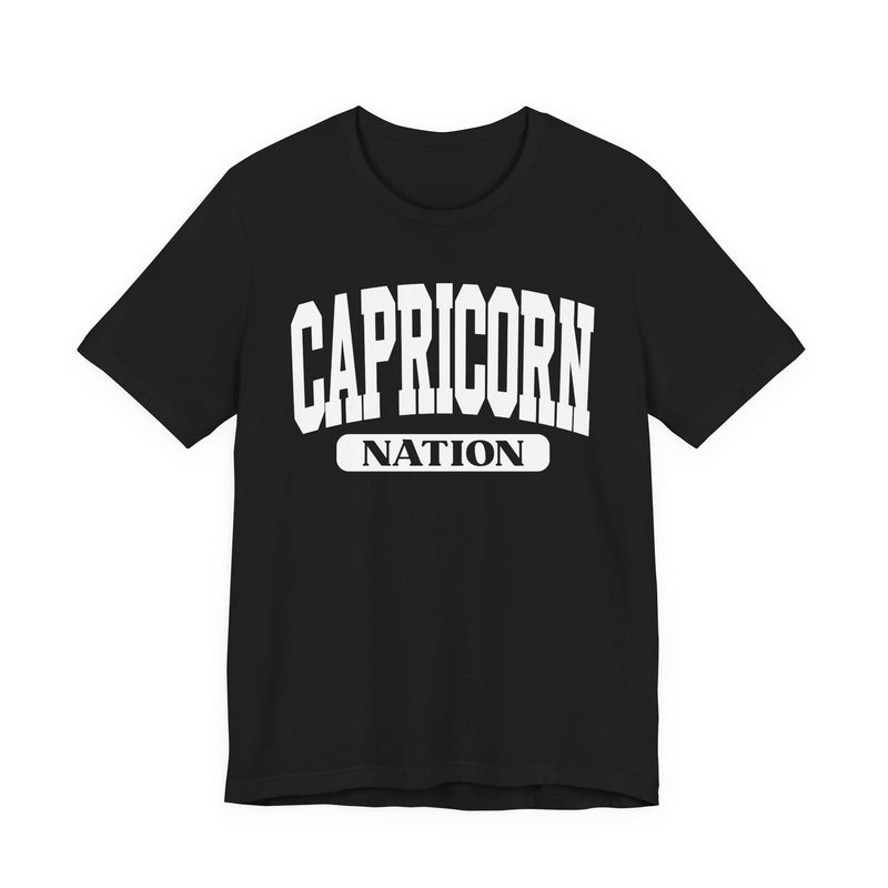 Black t-shirt with white arched CAPRICORN lettering and a NATION pill badge, front view.