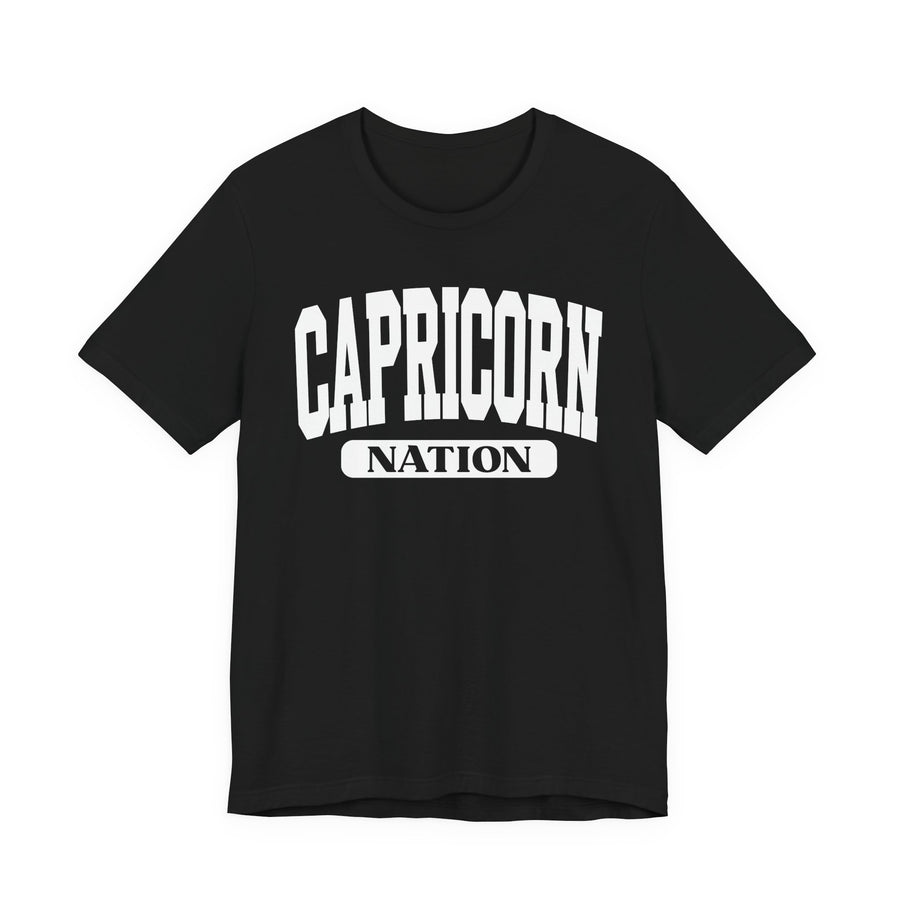 Black t-shirt with white arched CAPRICORN lettering and a NATION pill badge, front view.