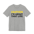 Caution I'm About That Life — Bold Warning Statement Tee
