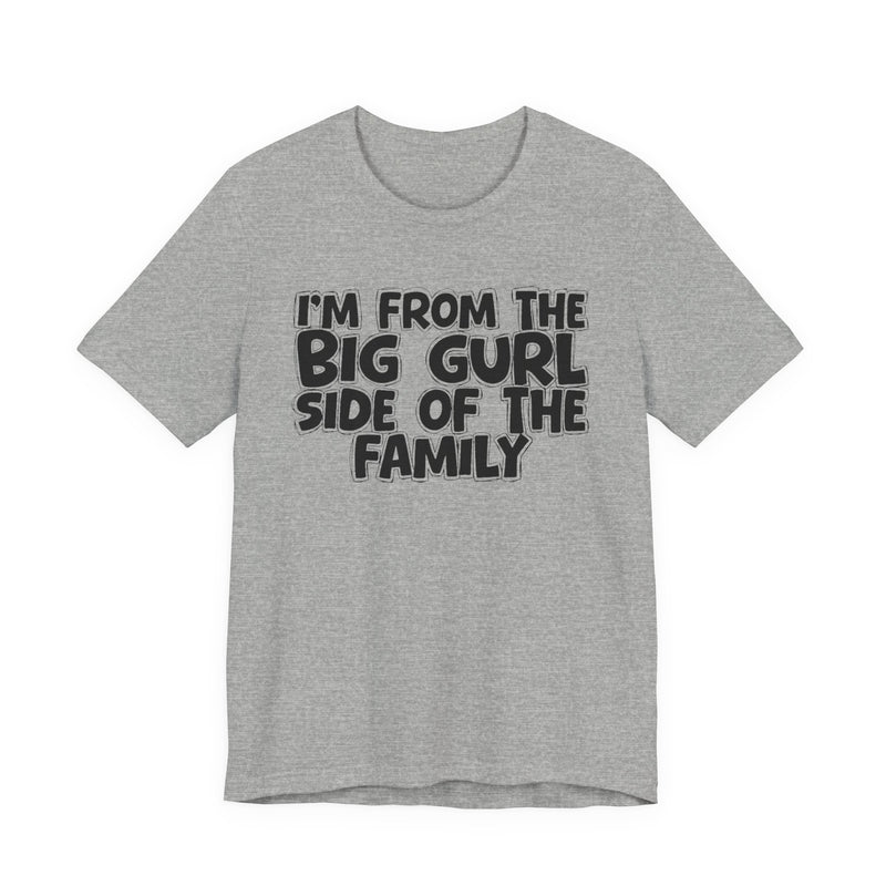 Navy t-shirt with bold chest statement text reading 'I'M FROM THE BIG GURL SIDE OF THE FAMILY,' front flat-lay view.