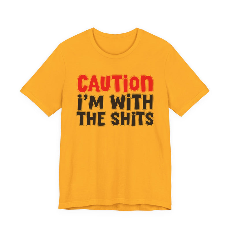 T-Shirt in Gold with lettering reading "CAUTION I'M WITH THE SHITS", front view.