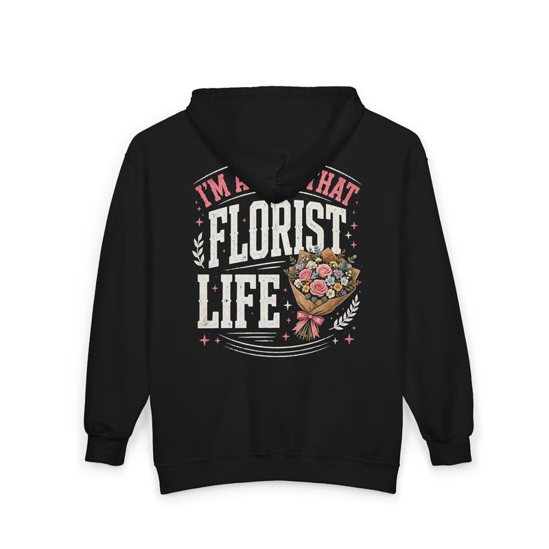 Charcoal zip hoodie with white and pink lettering reading "I'M ABOUT THAT FLORIST LIFE", back view.