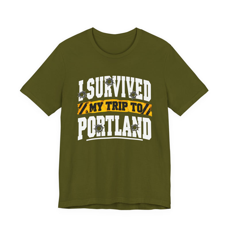 T-Shirt with collegiate lettering reading I SURVIVED MY TRIP TO PORTLAND, front view.