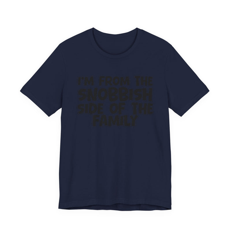 Navy t-shirt with white outlined bubble lettering reading 'I'M FROM THE SNOBBISH SIDE OF THE FAMILY', front flat-lay view.