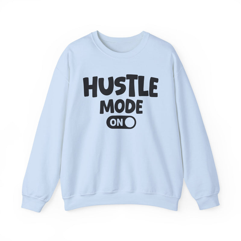 Light Blue sweatshirt with white bubble lettering reading "HUSTLE MODE ON", front flat-lay view.