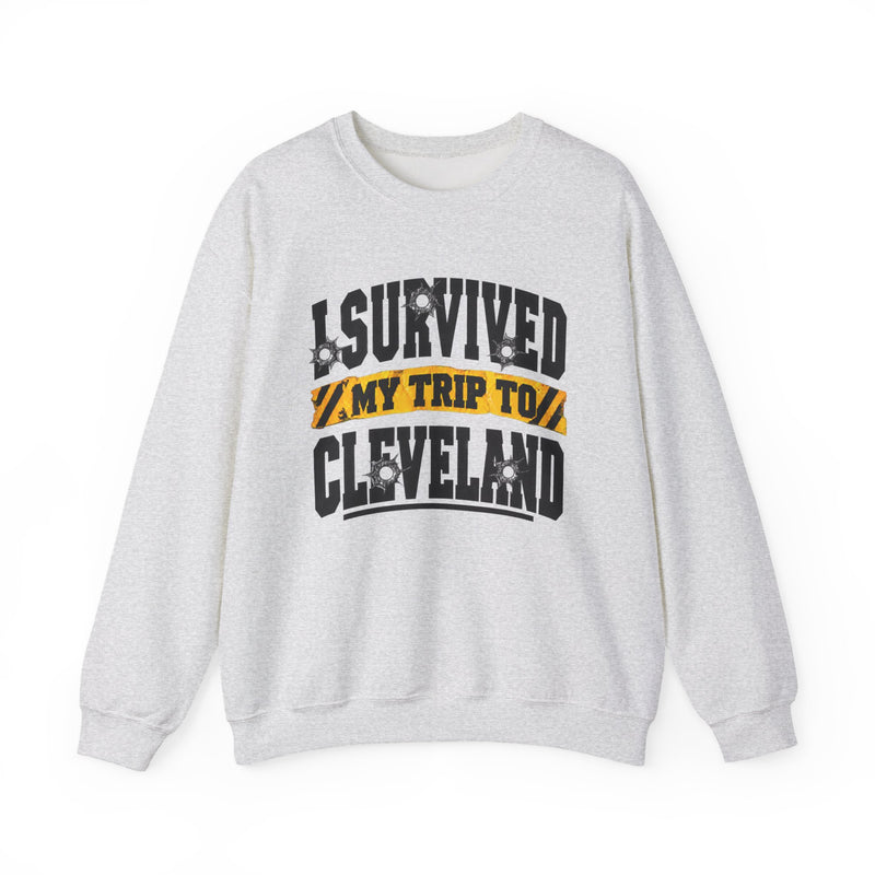 Sweatshirt product with collegiate lettering reading I SURVIVED MY TRIP TO CLEVELAND, flat lay.