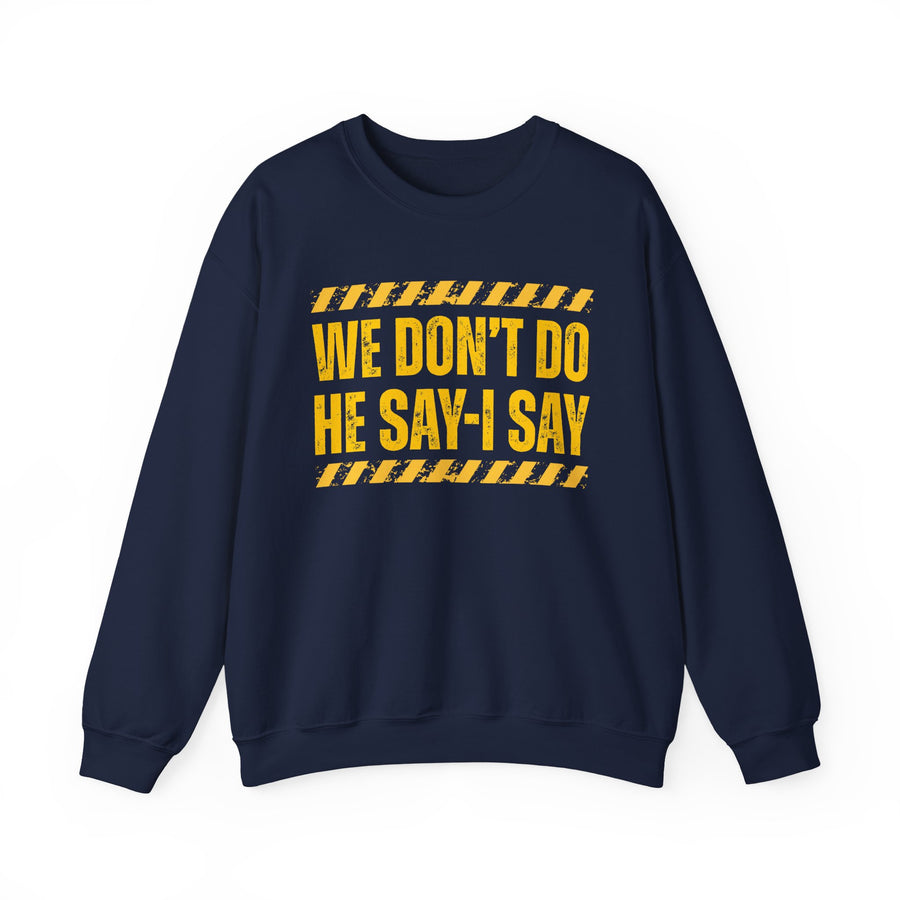Navy-color sweatshirt with distressed yellow lettering reading WE DON'T DO HE SAY-I SAY, front.