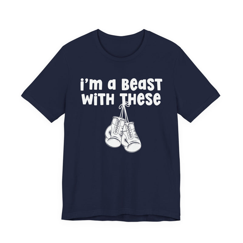 Navy t-shirt with boxing gloves and cream collegiate lettering reading I'M A BEAST WITH THESE, flat-lay view.