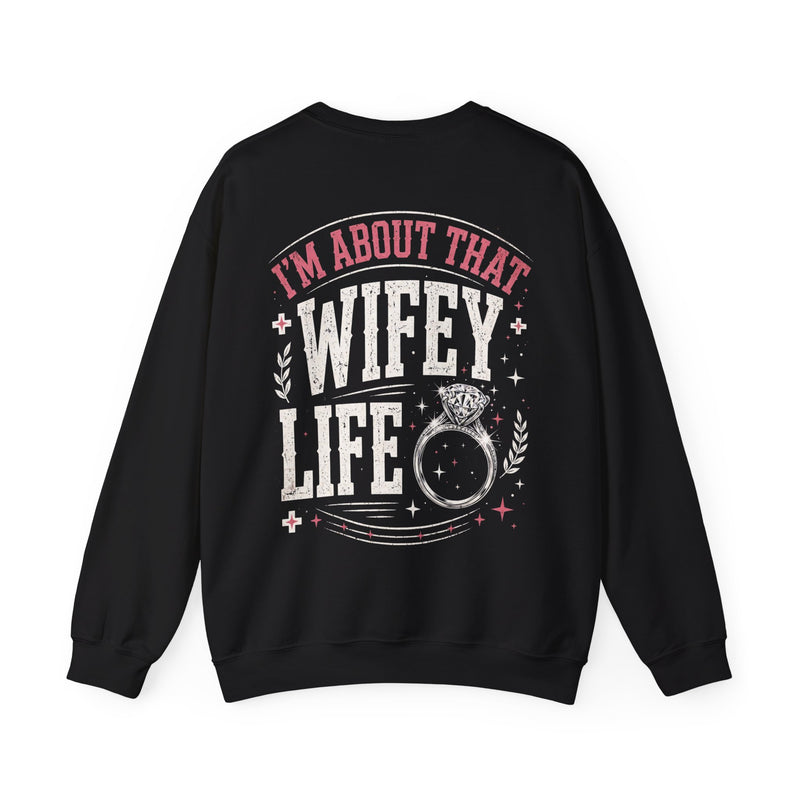 Black sweatshirt with multicolor retro I'M ABOUT THAT WIFEY LIFE lettering and ring graphic, front view.