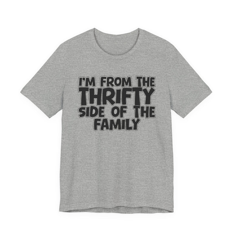 Athletic Heather t-shirt with white outlined bubble lettering reading 'I'M FROM THE THRIFTY SIDE OF THE FAMILY', front flat-lay view.