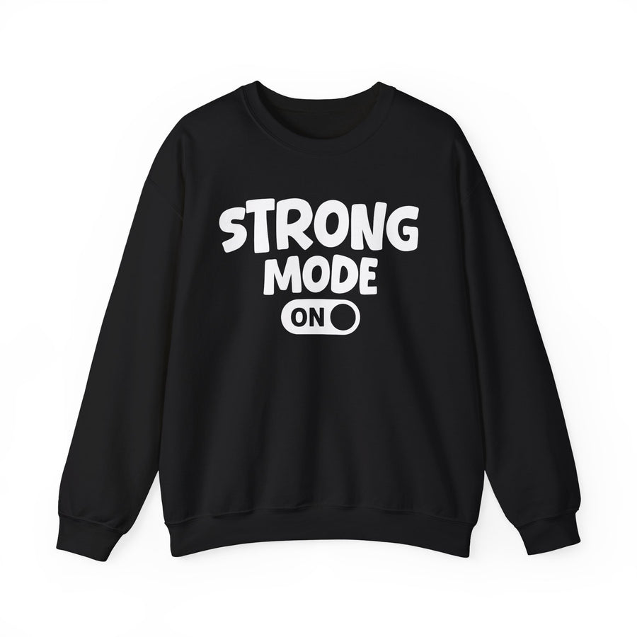Black sweatshirt with white rounded lettering reading STRONG MODE ON with an ON toggle-switch graphic, front flat-lay view.
