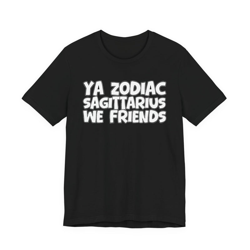 Black t-shirt with white 'YA ZODIAC SAGITTARIUS WE FRIENDS' cartoon bubble lettering, front flat-lay view.