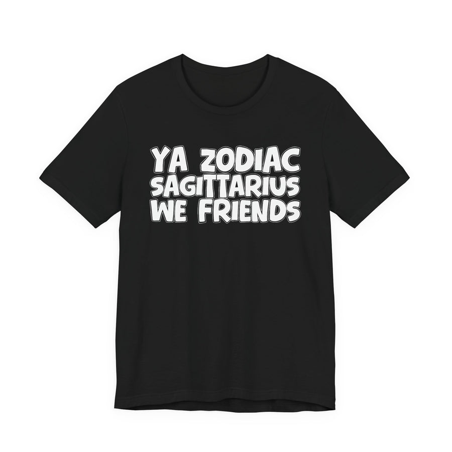 Black t-shirt with white 'YA ZODIAC SAGITTARIUS WE FRIENDS' cartoon bubble lettering, front flat-lay view.