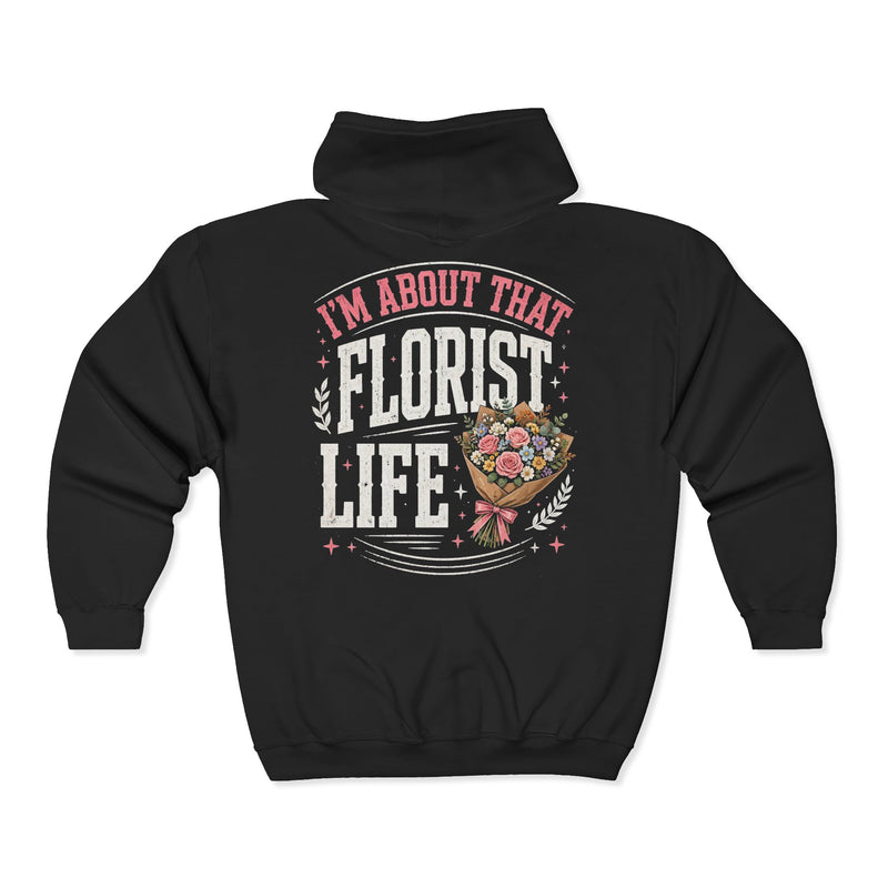 Black zip hoodie with white and pink lettering reading "I'M ABOUT THAT FLORIST LIFE", back view.