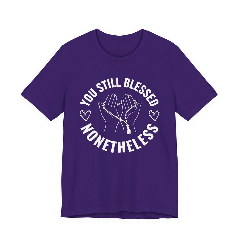 T-Shirt with “YOU STILL BLESSED NONETHELESS” statement print
