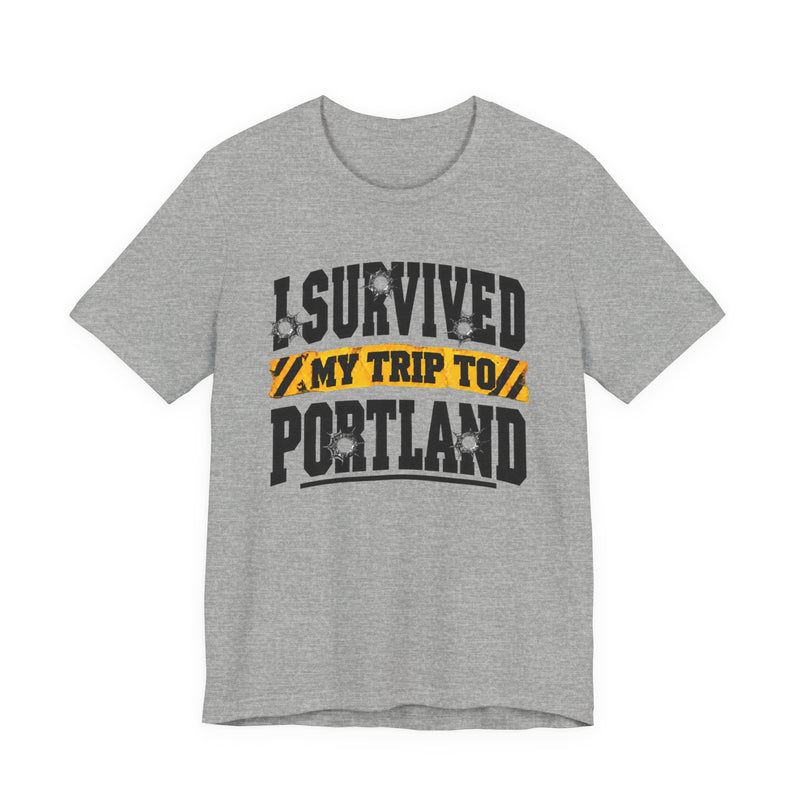 T-Shirt with collegiate lettering reading I SURVIVED MY TRIP TO PORTLAND, front view.
