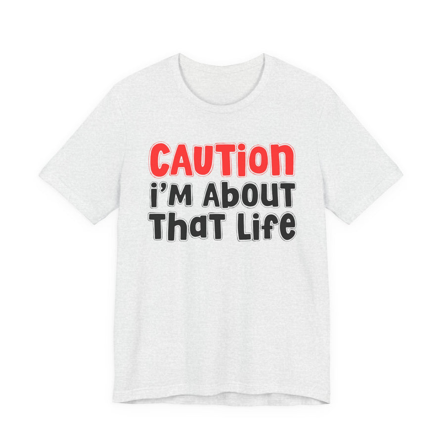 T-Shirt in Athletic Heather with lettering reading CAUTION I'M ABOUT THAT LIFE, front view
