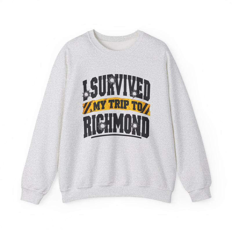 Sweatshirt product photo with arched collegiate lettering reading "I SURVIVED" with bullet-hole decals, a caution-tape band reading "MY TRIP TO", and large block letters reading "RICHMOND", front view.