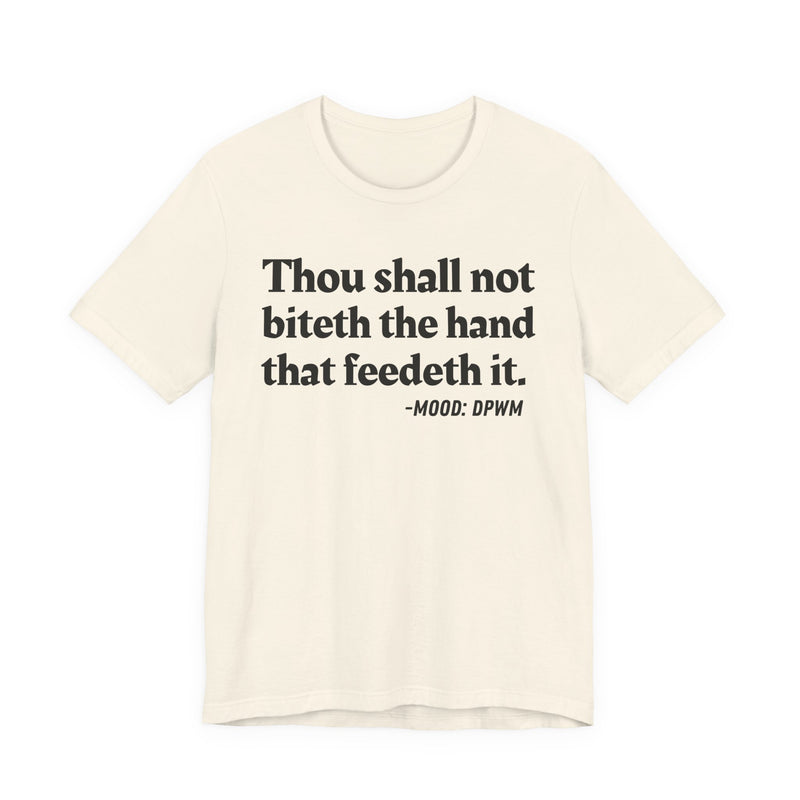 T-Shirt with text design reading “THOU SHALL NOT BITETH THE HAND THAT FEEDETH IT”, front view
