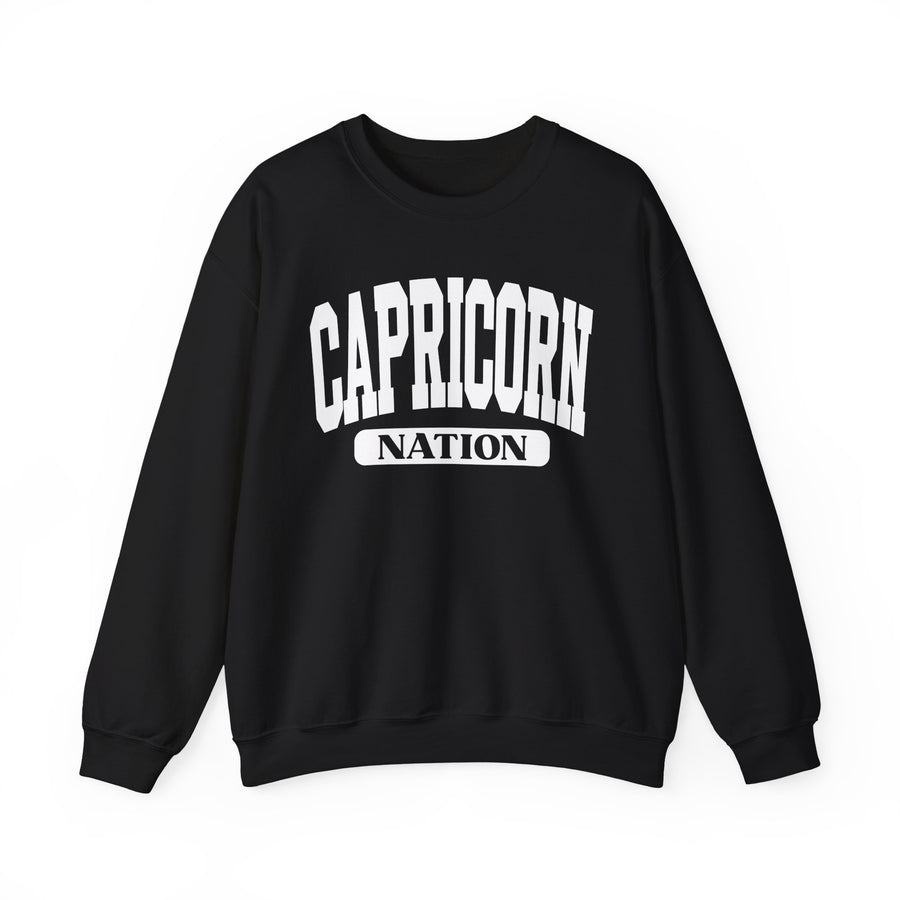 Black sweatshirt with white arched CAPRICORN lettering and a NATION pill badge, front view.