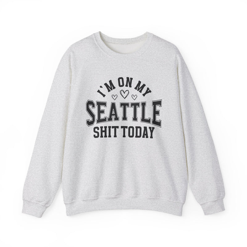 Sweatshirt product with collegiate lettering with heart accents reading I'M ON MY SEATTLE SHIT TODAY, flat lay.