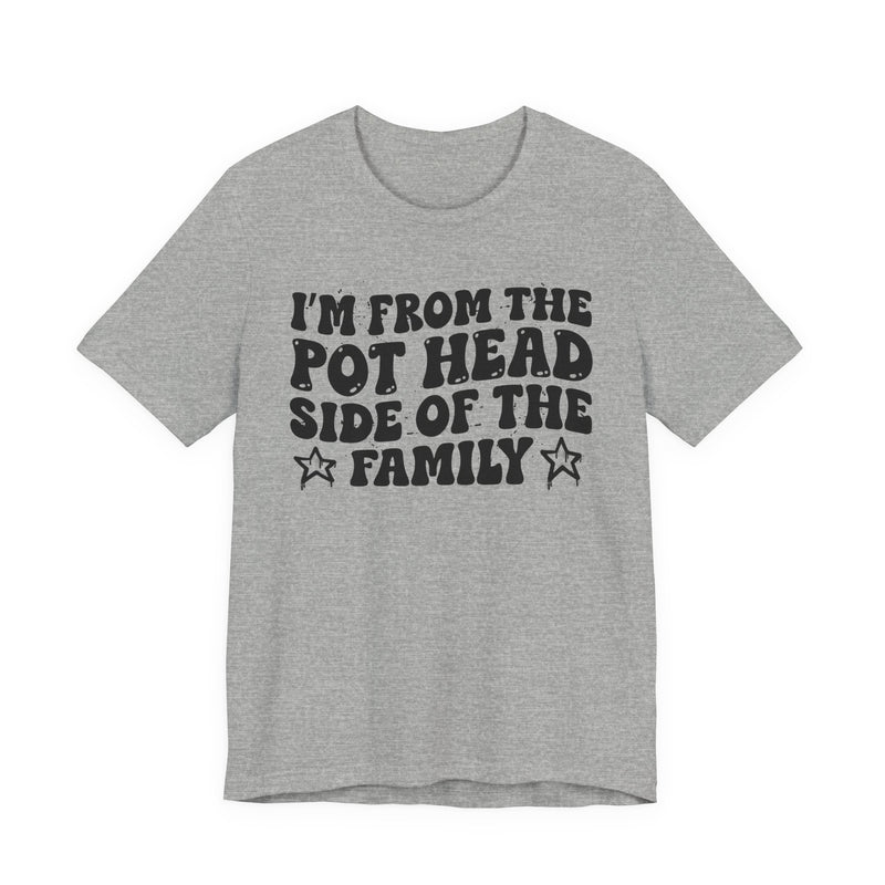 light t-shirt with ‘I’M FROM THE POT HEAD SIDE OF THE FAMILY’ statement text in bold outline lettering, front flat-lay view.