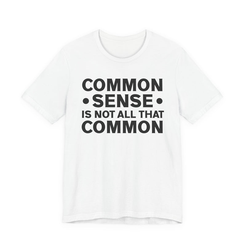 Sport grey t-shirt with black collegiate lettering reading COMMON SENSE IS NOT ALL THAT COMMON, flat-lay view.