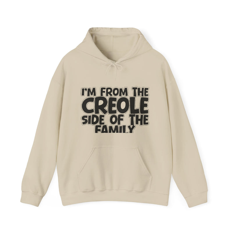 White hoodie with black bubble lettering reading I'M FROM THE CREOLE SIDE OF THE FAMILY, front flat-lay view.