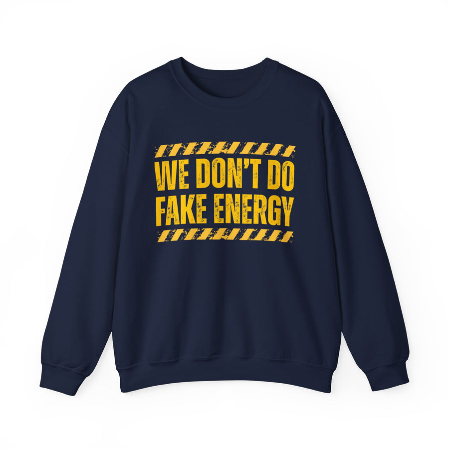 Navy sweatshirt with yellow and red caution-tape lettering reading "WE DON'T DO FAKE ENERGY", front flat-lay view.