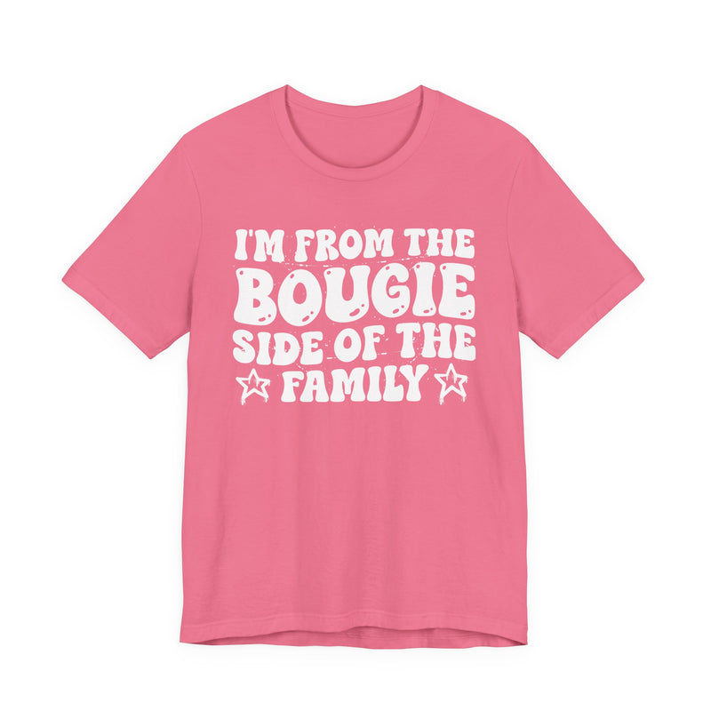 Charity Pink t-shirt with white outlined bubble lettering reading 'I'M FROM THE BOUGIE SIDE OF THE FAMILY', front flat-lay view.