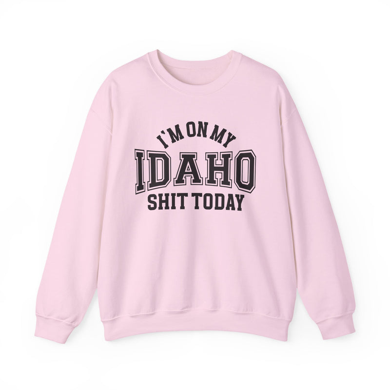 Light pink sweatshirt with black varsity block lettering reading I'M ON MY IDAHO SHIT TODAY, front flat-lay view.