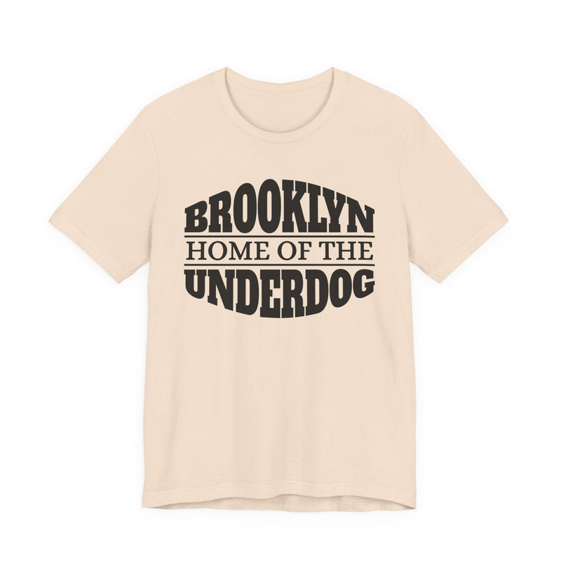 T-shirt with bold lettering reading BROOKLYN (HOME OF THE) UNDERDOG, product view.