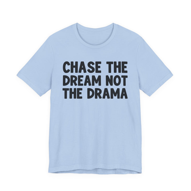 Carolina Blue t-shirt with black bold statement lettering reading CHASE THE DREAM NOT THE DRAMA, front flat-lay view.