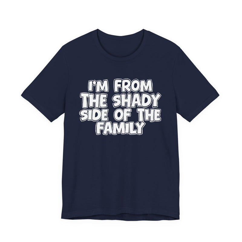 dark t-shirt with ‘I’M FROM THE SHADY SIDE OF THE FAMILY’ statement text in bold outline lettering, front flat-lay view.