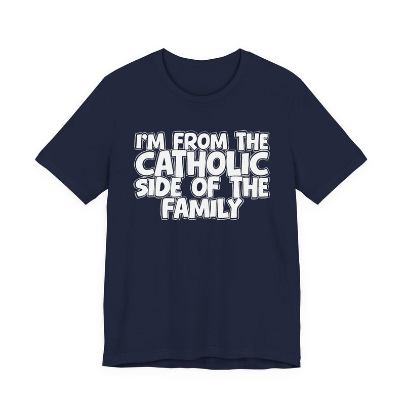 Navy t-shirt with white outlined bubble lettering reading 'I'M FROM THE CATHOLIC SIDE OF THE FAMILY', front flat-lay view.