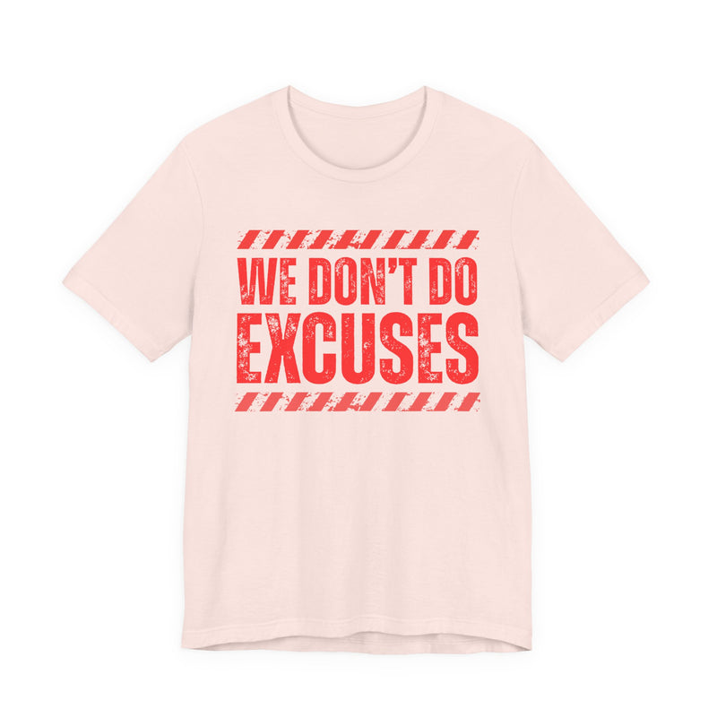 Cream t-shirt with red bubble lettering reading WE DON'T DO EXCUSES, front view.